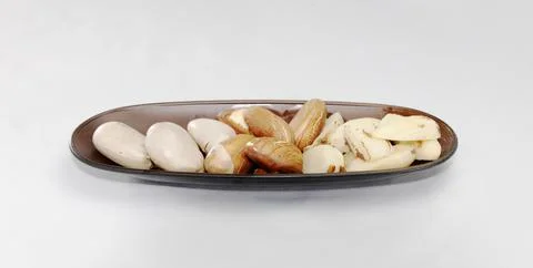 Three cooking steps or preparation of or Jackfruit seeds on a plate. Artocarp Stock Photos