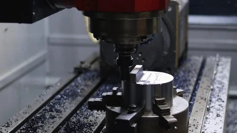 Three coordinate cnc milling machine processes steel billet. Stock Footage 124770863