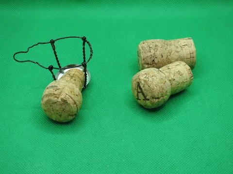 Three corks and a cradle Stock Photos