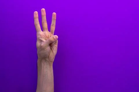 Three counting hands isolated on purple background Stock Photos
