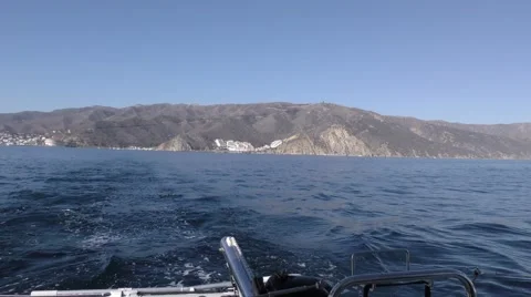 Three coves are in view as yacht leaves Catalina Stock Footage 67956644