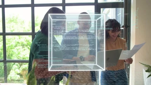 Three coworkers typing on laptop causing rotating 3D cube overlaying laptop with Stock Footage 334338095