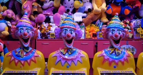 Three crazy clown head lucky ball game with soft toy prizes 스톡 동영상 104250266