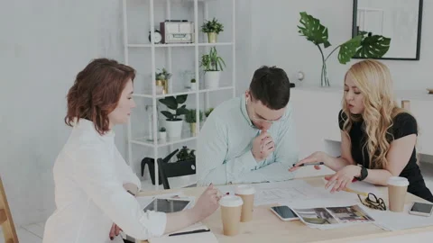 Three creative design professionals are involved in the workflow. Beautiful Stock Footage 106192736