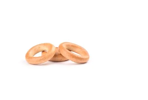 Three crispy bagels isolated on white background. Stock Photos