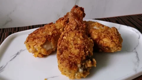 Three Crispy Fried Chicken Legs Stock Footage 161006128