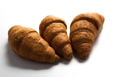 Three croissant on grey Foto stock