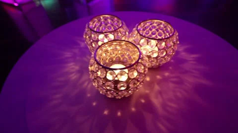Three crystal candle holders on a table 库存影片 31686665