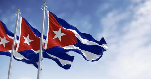 Three Cuban Flags Waving Under a Bright Blue Sky Stock Illustration