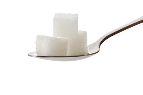 Three cubes of sugar on a spoon Stock Photos