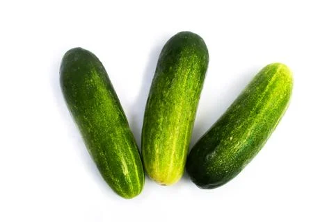Three cucumbers on a white background Stock Photos