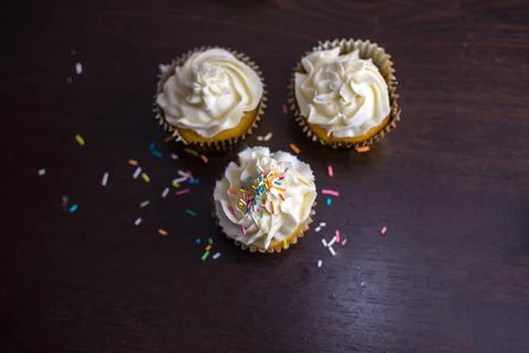 Three Cupcakes with sprinkles Stock Photos
