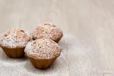 Three cupcakes on the wood table Stock Photos