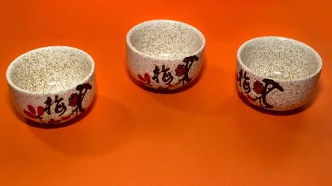 Three cups with a hieroglyph Stock Photos