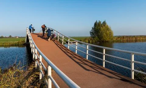 Three Cyclists Bridge Groot-Ammers Stock Photos