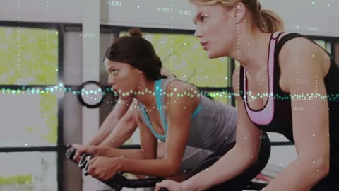 Three cyclists starting on coach cue, riding for fitness, data overlay mapping Stock Footage 331593636