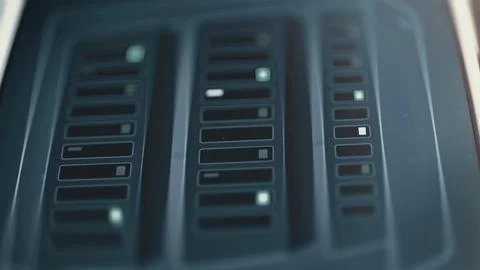Three dark server racks contain horizontal slots and scattered blue Stockfoto's