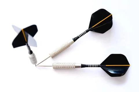 Three darts pointing the same target on an isolated white background. Straigh Stock Photos