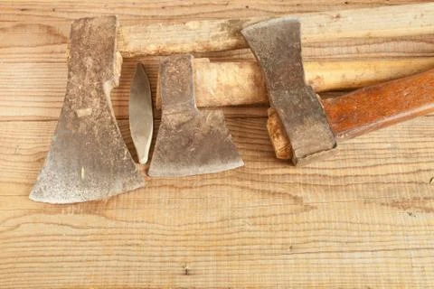 Three dated and used cleavers on wooden background Stock Photos