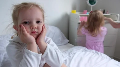 Three daughters play with makeup in the parents bedroom Stock Footage 131525424