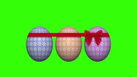 Three decorated easter eggs on green screen with red ribbon Stock Footage 304269641