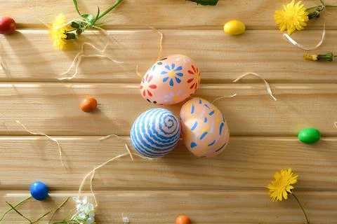 Three Decorative Easter Eggs on Wooden Table Stock Photos