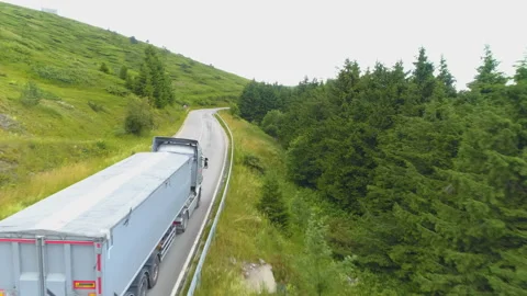 Three delivery trucks driving the mountain road 스톡 동영상 135668874