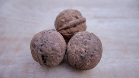 Three Desi Walnuts Isolated, Closeup, Neutral Background Stock Photos