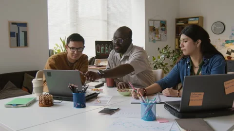 Three Developers Gathering to Discuss New App Stock Footage 317340917