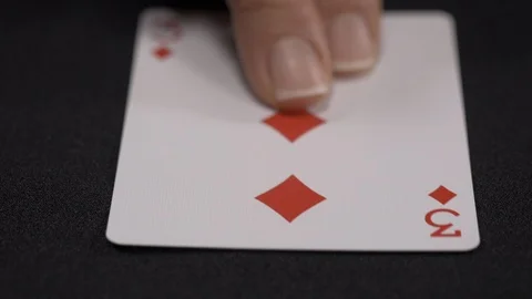 Three of Diamonds playing card, moving on a luxury black background 4k. Stock Footage 95573642