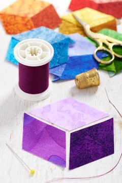 Three diamonds, which will be sewn in the form of a cube, which will form t.. Stock-Fotos