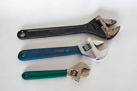 Three different adjustable wrench keys, large plan on a white background Stock Photos