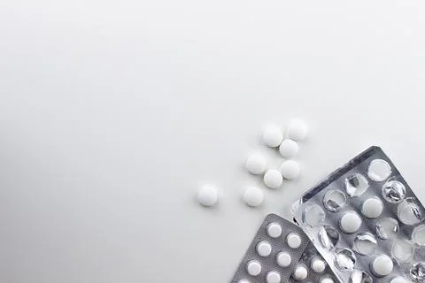 Three different blisters with white tablets of different form factors Stock Photos