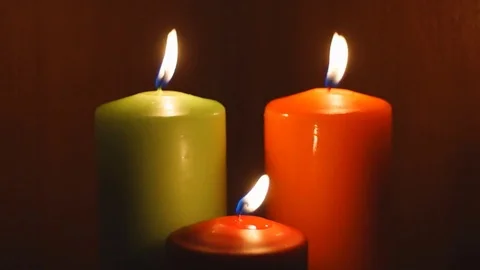 Three different candles burns in the dark 스톡 동영상 82371571