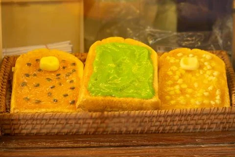 Three different colored breads with different toppings Stock Photos