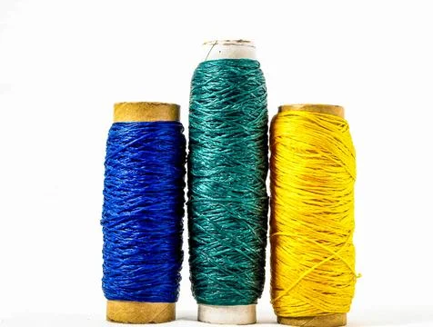 Three different colored threads are shown in a row Stock Photos