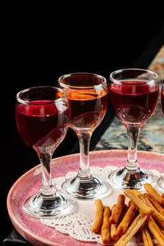 Three different drinks are arranged on a plate Foto stock