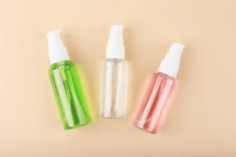 Three different face lotion, liquid foam or gel for skin cleaning in transparent Stock Photos