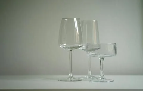 Three different glass goblets on the table. Glassware for alcoholic drinks Stock Photos