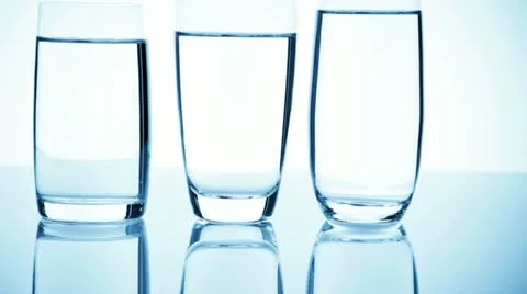 Three different glasses filled with water showing reflections Stock Footage 21318199