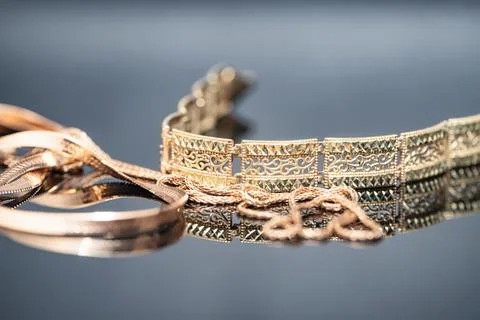 Three different gold chains in shape and size Stock Photos