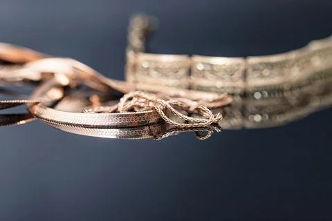 Three different gold chains in shape and size Stock Photos