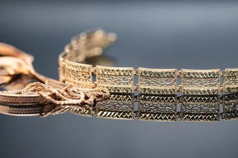 Three different gold chains in shape and size Stock Photos