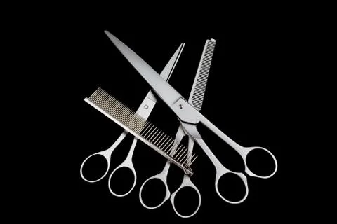 Three different kinds of  scissors and comb isolated Stock Photos