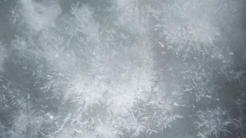 Three different macro shots of growing snow crystals, compilation of ice crystal Stock Footage