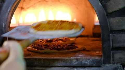 Three different pizzas in the oven. 4K Video. Stock Footage 100038583