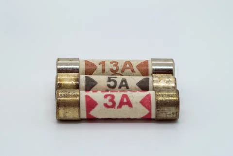 Three different rated UK plug fuses Stock Photos
