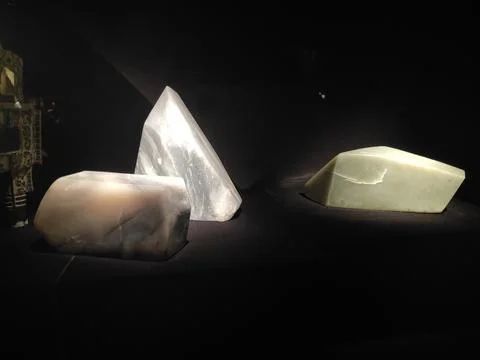 Three different shapes of white jade pieces, one triangular and two rectang.. Stock Photos
