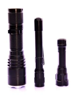 Three Different Size LED Torchlight Over White Background Foto stock