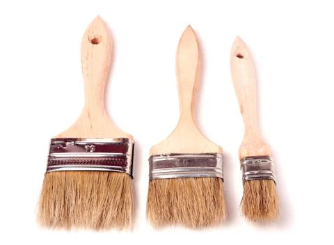 Three different size paint brushes isolated on white background Stock Photos